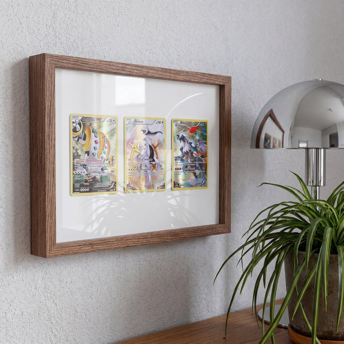 Black Walnut 3-card floating frame on a wall with Regigigas, Arceus and Kyurem