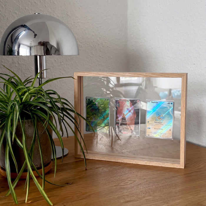 Log Wood 3-card floating frame with Japanese starter cards on a wood console with a chrome mushroom lamp